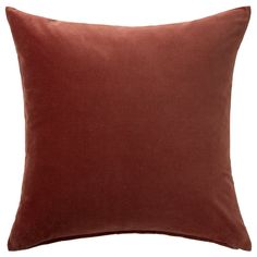 a brown pillow on a white background