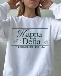 the kay dee (social club ♡ Super soft sweatshirt comes in unisex sizing! Reference the size chart for additional details. It is recommended to SIZE UP for an oversized fit   ♡ Sweatshirt comes in white with a forest green print. Please check listing photos for color reference! ♡ Please make sure you are ordering for the correct sorority before placing an order! This listing is for KAPPA DELTA. We are unable to accept returns or exchanges for this since all items are made to order.   ♡ INSTRUCTIONS FOR CARE:  1. Turn inside out before washing  2. Wash on a gentle cycle  3. Recommended not heat dry to prevent any minimal shrinking, hang to dry instead ♡ It is important that you LOVE your product! If you have any questions or concerns upon receiving your product, please contact me immediately Sorority Style Letter Print Sweatshirt For Spring, Sorority Crew Neck Top For Streetwear, Sorority Style Spring Sweatshirt With Letter Print, Sorority Letter Print Sweatshirt For Spring, Sorority Letter Print Sweatshirt In Relaxed Fit, Sorority Sweatshirt With Letter Print In Relaxed Fit, Spring Sorority Sweatshirt With Letter Print, Cotton Sweatshirt With Graphic Print For Sorority, Kappa Delta Sweatshirt