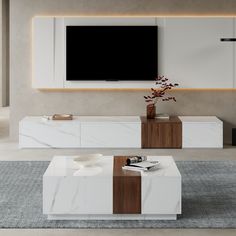 a modern living room with white and brown furniture in front of a flat screen tv