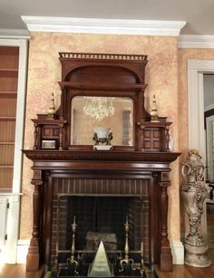 a fireplace with a mirror above it in a living room