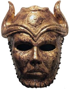 a bronze mask with horns on it's head is shown in front of a white background