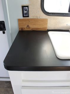 a sink and counter in a small room