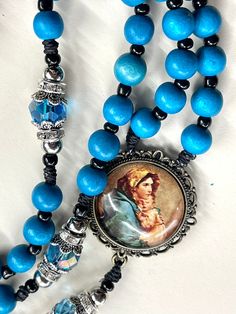 "Welcome to my Shop \"CREATING STILL MOMENTS.\"   To see all my listings and offerings, please visit my shop at  https://www.etsy.com/shop/CreatingStillMoments?ref=sh-carousel-1  handmade rosary using beautiful Teal Blue wooden Beads and beautiful Blue crystal Glass  \"our father\" beads.  These rosaries are beautiful and would make a wonderful First Communion/Reconciliation or Confirmation gift, wedding gift, or RCIA PSR gift.  The colors are vibrant and gorgeous!  The bronze crucifix is Made i Spiritual Blue Rosary With 108 Beads, Blue 108 Beads Spiritual Rosary, Handmade Blue Rosary For Jewelry Making, Handmade Blue Rosary With Cross Shape, Handmade Blue Rosary With Cross, Blue Spiritual Rosary Bracelet With 8mm Beads, Catholic Kids Crafts, Rosary Novena, Catholic Confirmation