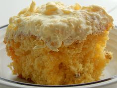 a close up of a piece of cake on a plate with frosted toppings