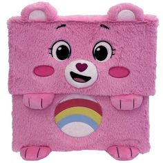 a pink stuffed animal with a rainbow on it's chest