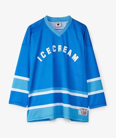 Born from the creative streets of Japan, Icecream has been redefining what’s cool since its inception. With a vision to blend playful designs with high-quality craftsmanship, this brand has made waves in the fashion industry worldwide.Get ready to embrace the warmer days of Spring/Summer 2024 with the stylish Icecream Hockey Shirt. Made with comfort and flair in mind, this long sleeve T-shirt in a stunning azul shade is perfect for those looking to add a pop of color to their wardrobe. Its relax Blue College Jersey With Graphic Print, Casual Blue Jersey With Graphic Print, Vibrant Streetwear, Hockey Shirts, Comme Des Garcons Shirt, The Fashion Industry, Ralph Lauren Long Sleeve, Bold Style, Street Culture