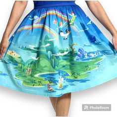 Dress The Part For Adventure! Soar To The Second Star To The Right With The Stitch Shoppe Never Land Scene “Sandy” Skirt. This Pattern Reimagines A Beloved Scene From Disney’s Animated Classic, Where Peter Pan Brings The Darling Siblings To Never Land. Look Closely And You’ll See The Lost Boys, Captain Hook And The Pirates, And The Mermaids In Their Lagoon. This Vibrant And Colorful Skirt Is Made Of Stretch Sateen (97% Cotton/3% Spandex) And Hits Just At The Knee On Most. The Sandy Style Skirt F Peter Pan Mermaids, Disney Christmas Outfits, Tulle Overlay Skirt, Minnie Mouse Skirt, Peter Pan Neverland, Disney Skirt, Second Star To The Right, Dark Skirts, Colorful Skirt