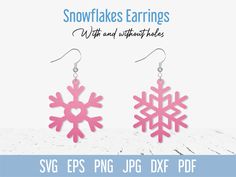 snowflakes earrings with pink and white frosting on them