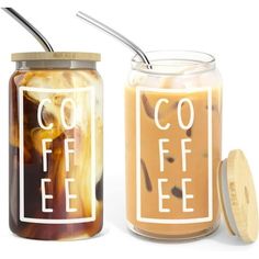 two jars filled with iced coffee sitting next to each other