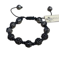 Gunmetal And Rhinestone Ball Slide Adjustable Cord Bracelet - New With Tags - Gunmetal Hammered Bead Balls With Black Rhinestone Bead Ball - Adjustable Slide Closure In Black Nylon Cord - Total Size At Largest Setting 13", Size At The Smallest Setting 8.25" - Original Retail $29 Adjustable Crystal Bracelet For Party, Adjustable Crystal Bracelet For Parties, Adjustable Metal Bracelets With Stones, Adjustable Gray Metal Jewelry, Adjustable Metal Crystal Bracelet With Rhinestones, Adjustable Beaded Gunmetal Jewelry, Adjustable Gunmetal Beaded Jewelry, Adjustable Silver Crystal Bracelet With Stones, Silver Crystal Bracelet With Black Beads For Party