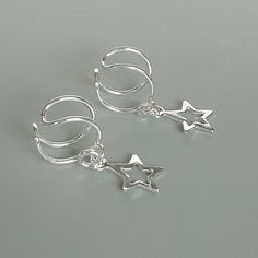 Star charm dangler, open ended sterling silver ear cuff. Dimensions: 6 x 8 mm Star: 8 x 8 Weight: .90gm Price listed is for ONE PIECE These are made of 925 hypoallergenic sterling silver. pieces come with a 925 stamp. Can be packaged in a gift box. I can include a personal message from you if needed You are welcome to contact me at... bhavnakwintra1956@gmail.com For more beautiful pieces from my shop, please browse 👇 TOE RINGS: https://www.etsy.com/your/shops/TheSilverGame/tools/listings/sectio Dainty Nickel Free Silver Ear Cuff, Silver Dainty Nickel Free Ear Cuff, Silver Dainty Pierced Ear Cuff, Dainty Silver Ear Cuff As A Gift, Dainty Silver Pierced Ear Cuff, Silver Dangle Ear Cuff As Gift, Silver Dainty Ear Cuff For Gift, Dainty Silver Single Ear Cuff, Dainty Silver Ear Cuff For Gift