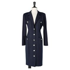 Navy blue wool dress with mother-of-pearls buttons Valentino Miss V For Sale at 1stDibs Wool Buttoned Workwear Dresses, Classic Career Dresses With Buttons, Elegant Navy Button-up Dress, Elegant Button-up Blazer Dress For Career, Elegant Blue Dress With Button Cuffs, Navy Formal Dress With Button Closure, Formal Navy Dress With Button Closure, Formal Blue Dress With Button Closure, Formal Blue Blazer Dress With Buttons