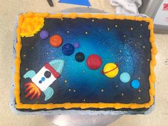 a birthday cake with an outer space theme