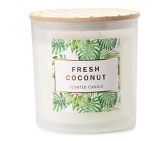 a glass jar filled with fresh coconut scented candle