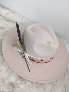 Neutral hat with a pop of the cutest pink bandana band wide brim fedora hat.   This hat is perfect for any cowgirl, country concert, girls trip or for that special occasion!   This hat has a pink bandana band with some layered ribbon, leather cording, and feather cluster along with the cutest cactus pin! There is custom stitching on the side and top brim for an extra special touch. This is a neutral color hat that can be matched to any outfit. This is a cream colored hat made of a polyblend. Thi Adjustable Hat Bands For Country Events In Spring, Bohemian Pink Sun Hat For Kentucky Derby, Pink Bohemian Sun Hat For Kentucky Derby, Pink Adjustable Hat Bands For Summer, Bohemian Pink Hat Band For Kentucky Derby, Trendy Brimmed Fedora For Kentucky Derby, White Hat Band For Spring Ranch Occasions, Western Style Adjustable Fedora For Spring, Adjustable Felt Hat For Summer Country Events