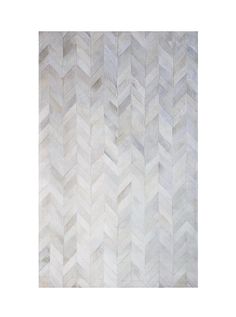 an area rug made out of white and grey herringbones on a white background