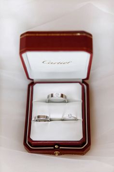 an open box with two wedding rings in it