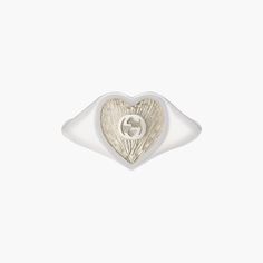 Sterling silver Gucci heart signet ring with white mother-of-pearl enamel. In the center of the Enamel the interlocking G logos is raised. The top of the ring is 0.04" in size. Mother Of Pearl Signet Ring, Luxury Hallmarked White Gold Enamel Ring, Gucci Sterling Silver Ring For Formal Occasions, White Engraved Ring With Polished Finish, Gucci White Gold Jewelry For Anniversary, Gucci White Gold Ring For Formal Occasions, Gucci White Gold Ring Formal, White Luxury Enamel Ring For Formal Events, Designer Gucci Rings With Polished Finish