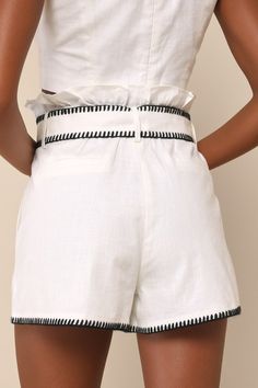 Your style is certain to get compliments in the Delightful Summer White and Black Embroidered Belted Shorts! Lightweight, linen-cotton blend fabric shapes these cute shorts that have a high waist (with ruffled trim) a hidden zip fly with top clasp closures, belt loops, and a wide belt with an O-ring detail at front. Oversized porkchop pockets accent the front, with decorative welt pockets at the back. Contrasting black embroidery accents the hems and edges, for a unique effect! Fit: This garment fits true to size. Length: Above mid-thigh. Waist: Fitted - very fitted at natural waist. Hip: Loosely Fitted. Fabric: Fabric has no stretch. Lined. Self: 55% Linen, 45% Cotton. Lining: 100% Cotton. Hand Wash Cold. Do Not Bleach. Line Dry. Iron Low Heat. Imported. Lulus | Delightful Summer White an Embroidered High Waist Shorts For Summer, Embroidered High Waist Summer Shorts, Chic Cotton Shorts With Elastic Waistband, White Cotton Shorts For Vacation, High Waist Linen Shorts For Vacation, Chic Embroidered Cotton Bottoms, White Embroidered Short Length Bottoms, White Embroidered Bottoms Short Length, High Waist Cotton Beach Shorts