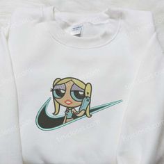 Bubbles x Nike Embroidered Shirt, Custom Nike Embroidered Shirt, The Powerpuff Girl Embroidered Shirt Step into the charming world of Tinicloset, your ultimate destination for enchanting custom embroidered shirts and apparel that will awaken your inner child and add a sprinkle of sweetness to your wardrobe. We take pride in offering a curated collection of embroidered treasures, each designed to capture the essence of childhood wonder and nostalgia. Allow us to introduce you to our standout crea Cute White Top With Embroidered Logo, Cute White Tops With Embroidered Logo, Cute White Top With Machine Embroidery, Cute White Tops With Machine Embroidery, Embroidered Shirts, Powerpuff Girl, The Powerpuff, Custom Nike, Custom Nikes