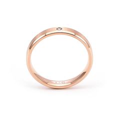 B.Tiff Rose Gold Pavé Beveled Edge Ring Discover the essence of refined taste with this exquisite rose gold ring. Its understated design boasts a single, brilliantly cut diamond, nestled flawlessly within a brushed finish. The warm hue of the rose gold elegantly complements the sparkle of the diamond, creating a harmonious blend of luxury and minimalism. The narrow chamfered edges on each side of the rim giving the ring bands a distinct 3D look and 3-sided metallic reflective surfaces with 2-ton Reflective Surfaces, Beveled Edge, Rose Gold Color, Rose Gold Ring, Band Rings, Gold Color, Diamond Cuts, Gold Rings, Jewelry Collection