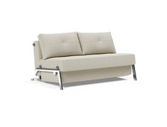 a white couch sitting on top of a metal frame