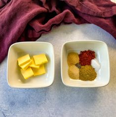 two white bowls filled with different types of food