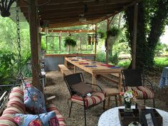 an outdoor seating area with tables and chairs