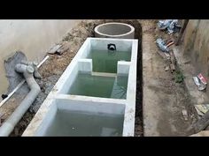 an unfinished basement with pipes and water in it