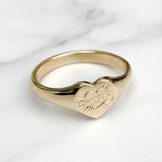 Brand new solid 9ct yellow gold ladies heart signet ring with a unique hand engraved love design  Made to order - 3-4 weeks before being ready to post Ring sizes available - UK - F to U , US 3 to 10 Ring in images is a size T Face size - 8.9mm x 8.9mm  Weight - 4g Size T Hallmarked and highly polished This signet ring comes in a lovely vintage style ring box! Please make contact if you have any questions regarding the item! Follow Heirlooms & Signets on Instagram for the latest updates - https://www.instagram.com/heirloomsandsignets/ Thank You Hannah Heart Signet Ring, Engraved Heart Shaped Yellow Gold Signet Ring, Heirloom Heart-shaped Signet Ring As Gift, Heirloom Heart-shaped Signet Ring For Gift, Classic Heart-shaped 14k Gold Signet Ring, Heart-shaped 14k Gold Signet Ring As Gift, Vintage Style Rings, Love Design, Ring Box