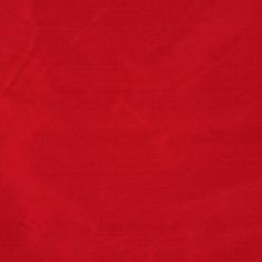 a red cloth textured with some sort of pattern on it, as well as the background