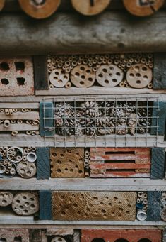 many different types of wood and metal items are stacked on top of eachother