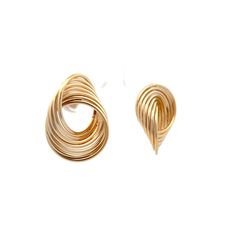 These stud earrings in 14 karat yellow gold feature interlocked circles creating a unique swirl pattern that is both geometric and fluid. The polished gold finish adds a radiant glow, making these earrings suitable for any occasion. Lightweight and comfortable, they are ideal for all-day wear. Their distinctive design blends modern style with classic appeal, making them a standout piece in any jewelry collection. Whether for a special night out or everyday wear, these swirl earrings offer elegance and individuality. Engagement Ring Style Guide, Ring Style Guide, Platinum Rose Gold, Swirl Earrings, Sapphire Solitaire, Swirl Pattern, Engagement Ring Styles, Shop Engagement Rings, Shop Necklaces