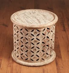 a wooden table sitting on top of a wooden floor next to a wood flooring