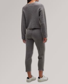 A lightweight layering essential, this cozy long sleeve features dropped shoulders, button front, and slightly cropped length. Dropped shoulders Long sleeves Relaxed fit Slightly cropped length Ribbed cuffs and hem Pullover style Viscose/polyester/nylon Imported Loungewear Cropped Sweater With Ribbed Collar, Casual Solid Cropped Sweater With Ribbed Cuffs, Fall Loungewear Tops With Button Cuffs, Casual Fitted Sweater For Loungewear, Casual Cropped Sweater With Ribbed Collar For Loungewear, Casual Cozy Fit Cropped Sweater With Ribbed Cuffs, Casual Cropped Sweater For Layering, Casual Stretch Bottoms With Cropped Hem, Casual Cropped Sweater With Ribbed Cuffs For Work