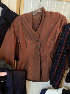 "Lot of 1940's and 1950's ladies blazers. 6 in total. Overall good vintage contain, but some have imperfections 1. Red black and blue plaid wool blazer with spots of white. 34/35\" bust, 30\" waist, shoulder to hem is 21\". Many moth holes, largest is in the left shoulder 2. Olive green cropped pullover top with white yarns and half sleeves. 38\"bust, shoulder to hem 18\" 3. 1940's light brown blazer with delicate gold buttons. Slightly reflective material. 42/44\" bust, 34\" waist, 22\" shoulde Ladies Blazers, Brown Winter Coat, 1950 Women, Vintage Gold Rings, Cropped Pullover, Women's Blazers, Navy Blue Blazer, Brown Blazer, Reflective Material