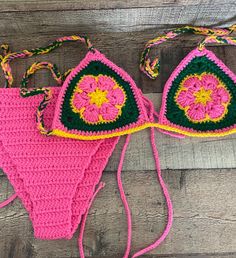 Handmade crochet colorful flower bikini set Triangle Bikini top and Bikini bottom. Washing machine wash  Do not put in dryer Sizes for Bikini Top and Bottom: S - L Bikini Bottom Colors: Pink, yellow, and green. Message me if you have any questions! I am happy to answer! Handmade Multicolor Swimwear For Beach Season, Handmade Multicolor Beachwear Swimwear, Bohemian Multicolor Crochet Swimwear, Bohemian Crochet Swimwear For Swimming, Bohemian Crochet Swimwear, Handmade Multicolor Swimwear For Beach, Handmade Multicolor Swimwear For Vacation, Fitted Multicolor Crochet Swimwear, Handmade Multicolor Beach Swimwear