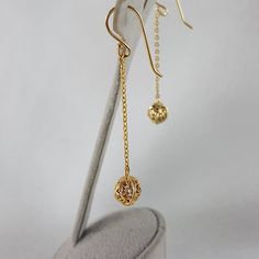 Elevate your style with our Aesthetic Long Chain Filigree Bead Drop Gold Earrings, combining elegance and minimalism in one stunning design. These threader earrings feature delicate chains and filigree bead drops crafted in 14k gold, perfect for adding a touch of sophistication to any outfit. With a width of 7 mm (1/4 inch) and a length of 52 mm (2 1/16 inches), and weighing 2 grams, they offer lightweight comfort ideal for everyday wear. An ideal gift for her or a stylish addition to your colle Elegant Linear Drop Earrings With Delicate Chain, Elegant Gold Round Threader Earrings, Elegant Dangle Threader Earrings With Delicate Chain, Delicate Dangle Linear Earrings With Adjustable Chain, Delicate Dangle Linear Earrings With Chain, Dainty Linear Earrings With Delicate Chain For Gift, Delicate Dangle Linear Earrings, Dainty Gold Plated Threader Earrings, Dainty Metal Earrings With Delicate Chain Detail