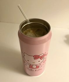 a pink hello kitty tumbler cup with a straw in it