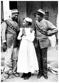 an old black and white photo of two men and a woman standing next to each other