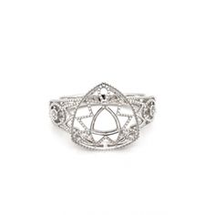 a white gold and diamond ring with an intricate design on the front, surrounded by smaller diamonds