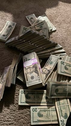 a pile of money laying on the floor