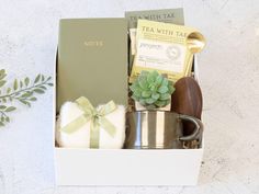 a gift box containing tea, soap and other items for someone's special occasion