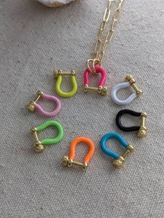 the necklace is made up of different colored clips