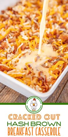 baked hash browns casserole with cheese being drizzled over it in a white dish