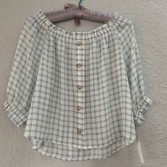 Cute For Spring! Off The Shoulder Checkered Blouse. Non Functional Buttons Down The Front. Elastic Around Neckline And At Elbow On Sleeves. Nwt! Casual Button-up Peasant Top For Summer, Spring Button-up Tops For Daytime, Spring Daytime Button-up Tops, Casual Button-up Tops For Brunch, Peplum Wrap Top, Checkered Blouse, White Cotton Blouse, Checked Blouse, Green Floral Dress