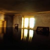 an empty room with sunlight coming through the windows