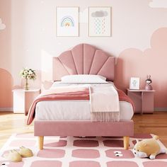 a bedroom with pink walls and flooring has a bed, nightstands, and rug