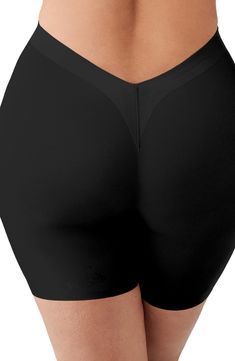 Designed to smooth the thighs, these shaping shorts are cinched at the waist with more room in the hips and bottom to fit and flatter an hourglass figure. Hidden stays keep it from rolling or losing its shape, and the V-back and raw edges keep it smooth and discreet under low-back outfits. 5 1/2" inseam Moderate control Cotton-lined gusset 54% polyamide, 46% spandex Hand wash, dry flat Imported Solid Biker Shorts With Wide Waistband, Solid Color Biker Shorts With Wide Waistband, Fitted Bottoms With Built-in Bra, Mid-thigh Length, Contoured Waistband Shapewear In Neutral Color, Solid Shapewear With Contoured Waistband, Shaping Smoothing Short Bottoms, Stretch Biker Shorts For Night Out, Solid Color Shapewear With Contoured Waistband, Elegant Fitted Above Knee Shorts