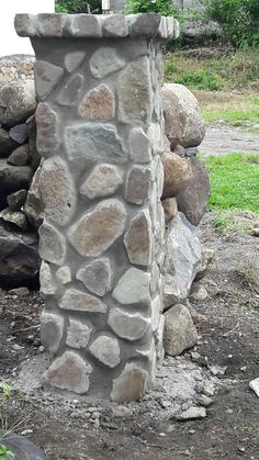 there is a stone pillar made out of rocks